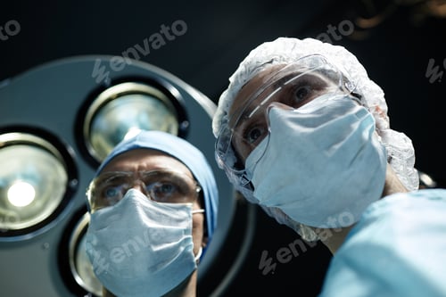 Preview: Low Angle Two Surgeons Wearing Masks
