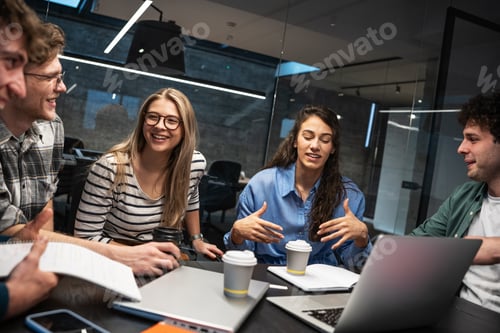 Preview: Programmers work alongside their colleagues in an office