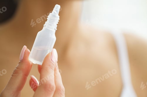 Preview: Young Girl Holds Eye Drops In Hands