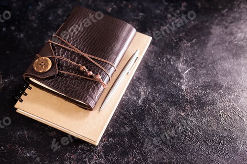 Preview: Hand made retro vintage notebook on a dark board