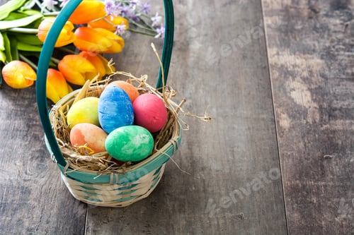 Preview: Easter eggs in basket with tulips on rustic wooden table