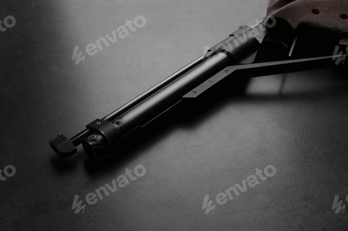 Preview: Sport pistol on black table. Professional gun
