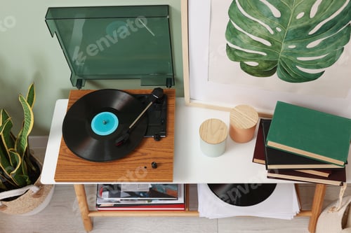 Preview: Stylish turntable with vinyl record console table in room, above view