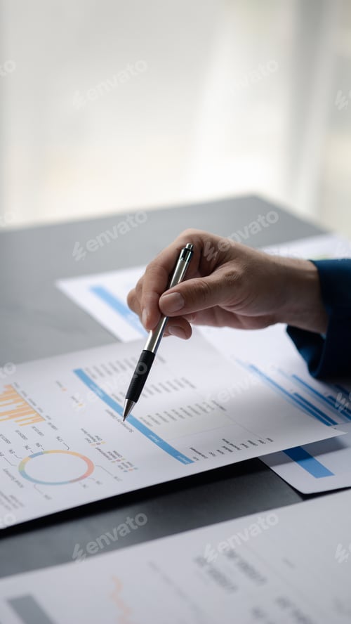 Preview: Business men are looking at the company's financial documents to analyze problems and find solutions