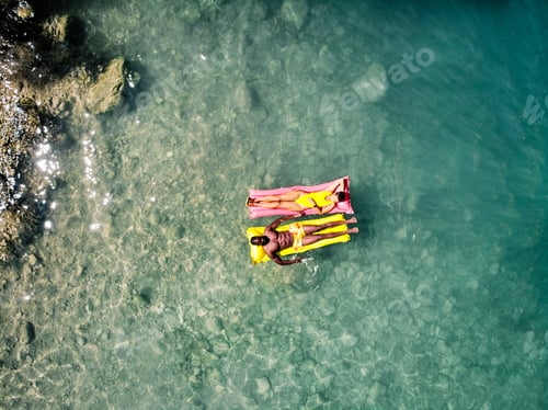 Preview: Diverse couple chilling on floats