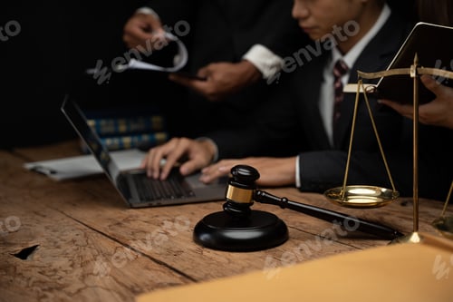 Preview: Close up lawyer businessman working or reading lawbook in office workplace for consultant lawyer con