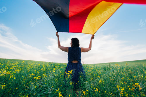 Preview: German flag outdoors on a meadow.