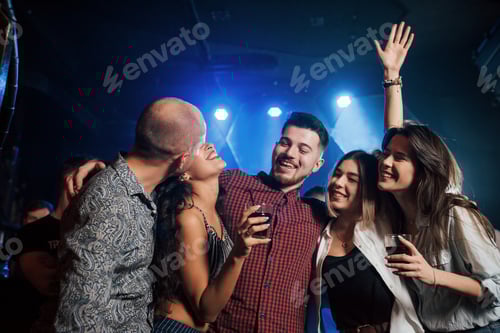 Preview: Spontaneous kiss. Beautiful youth have party together with alcohol in the nightclub