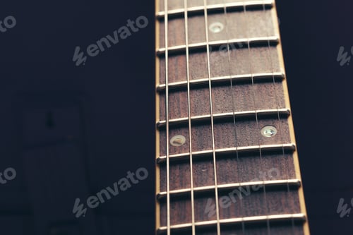 Preview: Electric guitar body and neck detail on wooden background