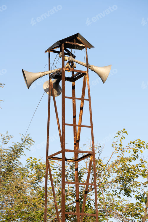 Preview: Vertical shot of tower of electric sirens for warning the population