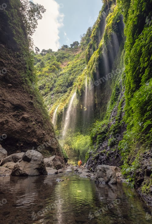 Preview: Beautiful Madakaripura waterfall flowing in rocky valley