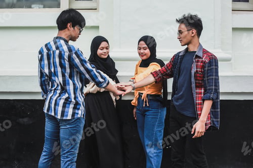 Preview: Team Hand Shake By Group Of Young People