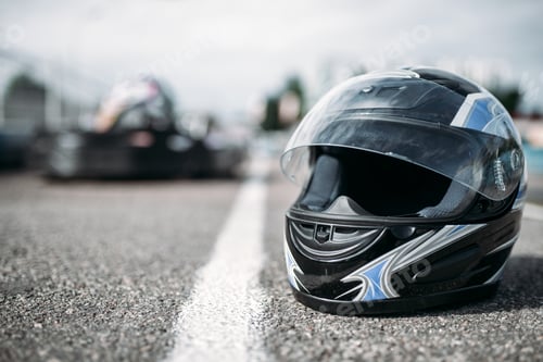 Preview: Racer helmet on asphalt, karting sport concept