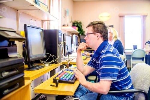 Preview: Young man with down syndrome, learning at computer