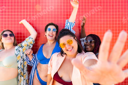 Preview: Group of plus size women with swimwear at the beach