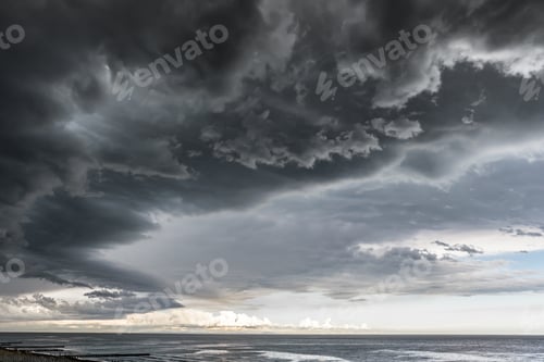 Preview: Approaching storm cloud with rain over the sea