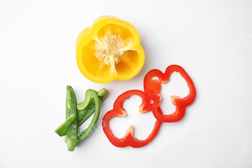 Preview: Cut ripe paprika pepper on white background, top view