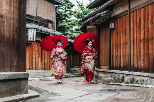 Preview: Maiko geishas walking on a street of Gion