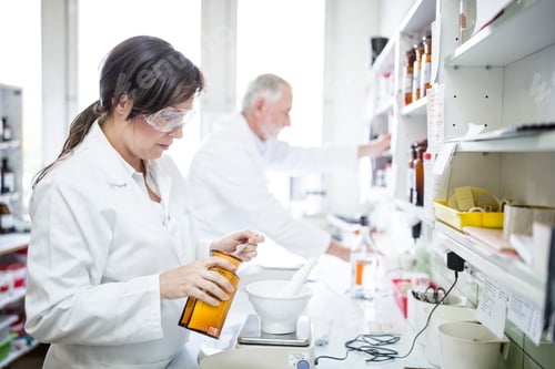 Preview: Man and woman working in laboratory of a pharmacy