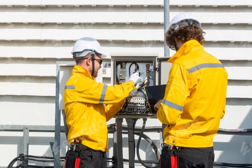 Preview: Engineers inspecting rooftop electrical equipment