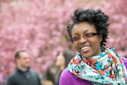 Preview: A group of people under the cherry blossom trees in the park