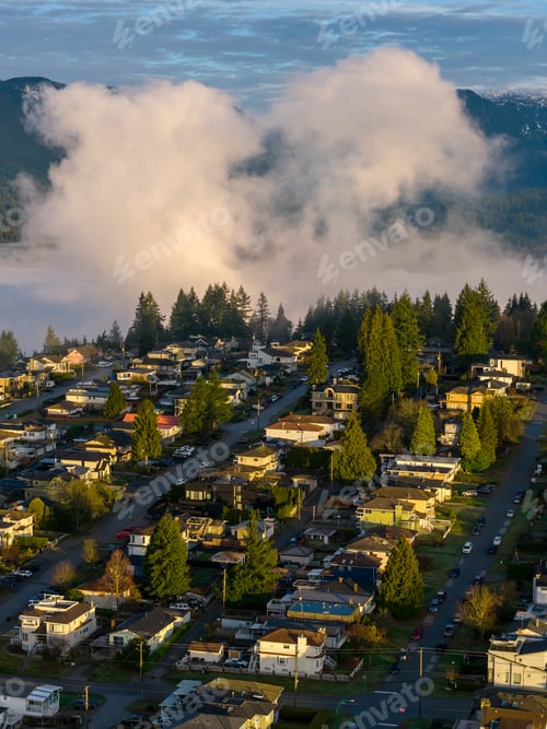 Preview: Sunlit Suburban Neighborhood Over Foggy Hills With Mountain Backdrop in Burnaby, BC, Canada