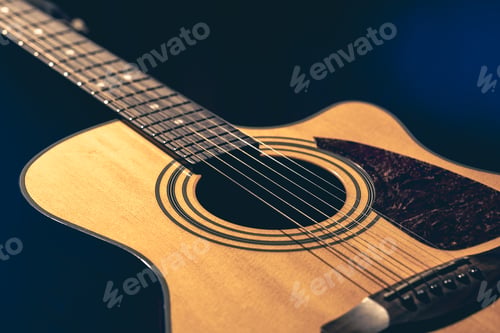 Preview: Musical background with acoustic guitar close up.