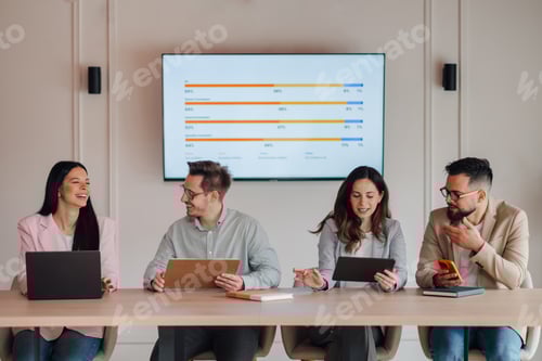 Preview: Business people having meeting discussing charts on screen in office