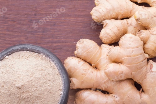 Preview: Roots and ginger powder on the table, top view