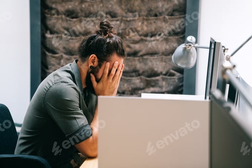 Preview: Tired exhausted man, office worker, manager or freelancer, working in office