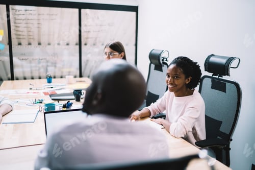 Preview: Businesswoman with partners during cooperation at workplace