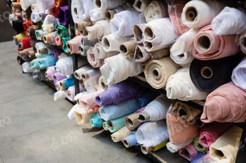 Preview: Colorful fabric rolls on shelves in textile shop