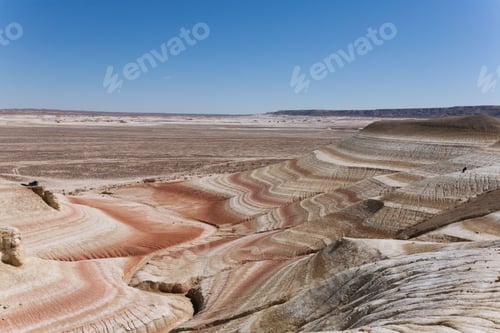 Preview: Striped Rock Formations in Desert Landscape