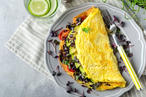 Preview: Omelet with avocado, micro greens and tomato healthy breakfast