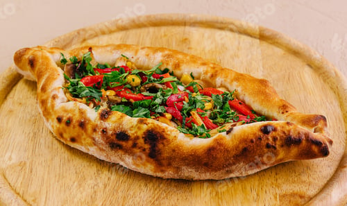 Preview: traditional turkish meat pide on wooden