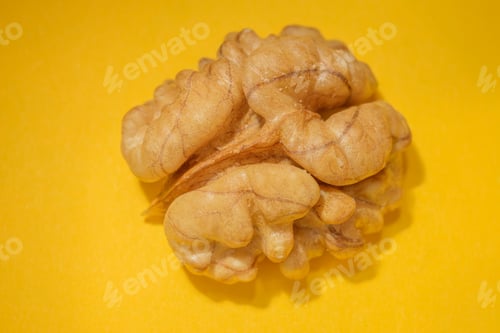 Preview: Whole Kernel Walnut On A Yellow Background