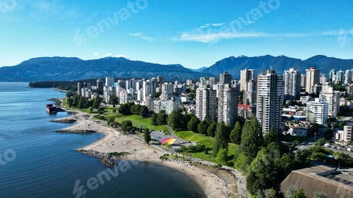 Preview: Aerial cityscape view of Vancouver buildings by the English bay on a sunny day