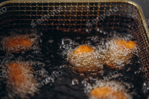 Preview: Close up image of cooking chicken nugget tempura in deep fry