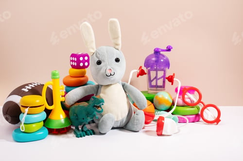Preview: Toys for children ready for donation on beige, copy space
