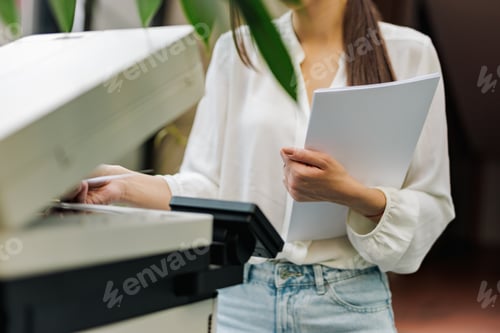 Preview: Female standing at the office, turning the scanner on.
