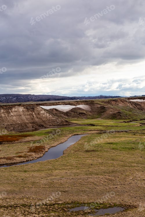 Preview: Scenic View of Yellowstone Landscape Under Dramatic Sky