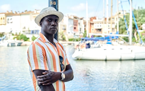 Preview: Black man on embankment