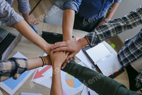 Preview: Top View Of team huddle, representing partnership and support