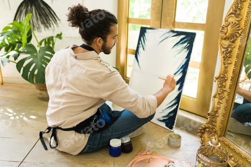 Preview: Inspired painter painting a canvas