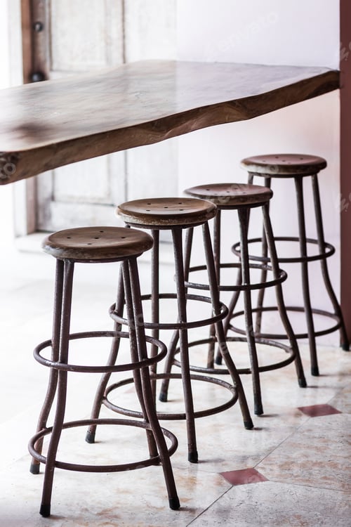 Preview: Bar with wooden vintage round tall chairs