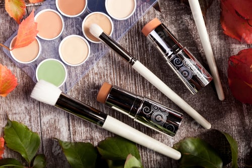 Preview: Professional cosmetics make up prducts in autumn concept on dark wooden background
