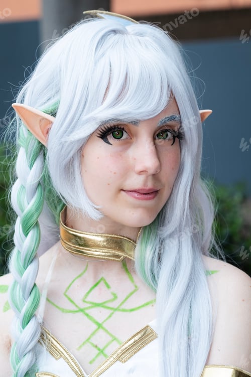 Preview: Caucasian female cosplayer dressed as an anime character in a white dress