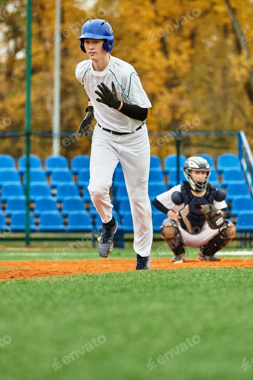 Preview: Teenage boys enjoying a lively baseball game on a sunny afternoon in the park