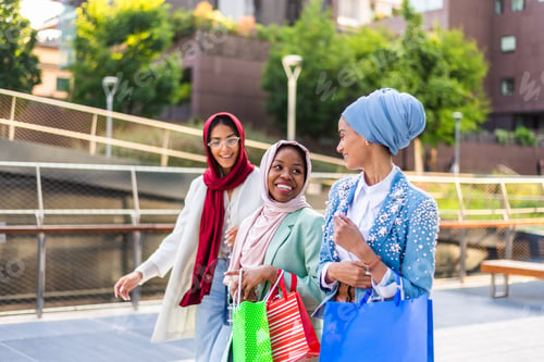 Preview: Beautiful muslim girl wearing hijab bonding outdoors