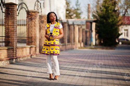 Preview: African woman in yellow